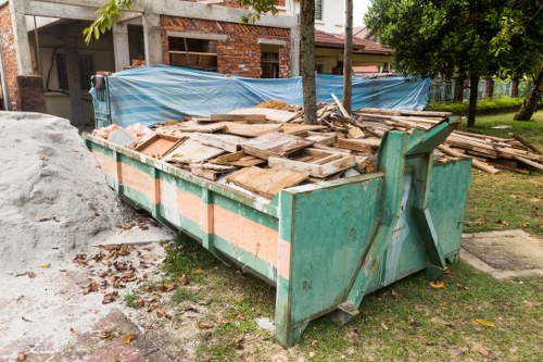 Construction site with waste clearance services in action