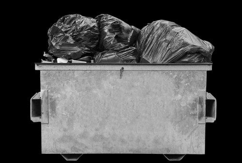 Company van collecting commercial waste at premises entrance